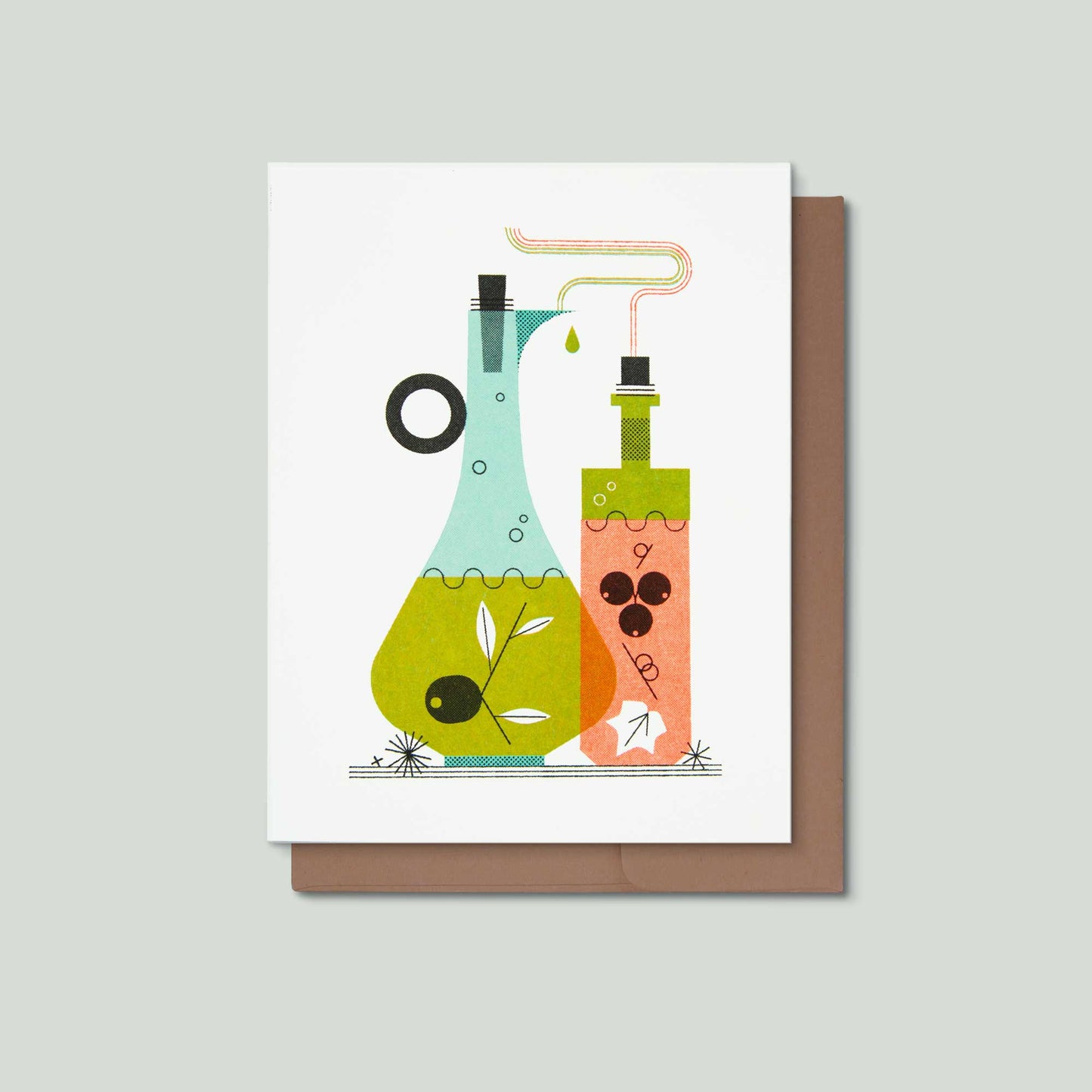 A white greeting card featuring a colorful illustration of oil and vinegar, shown with a brown envelope on a light gray background.