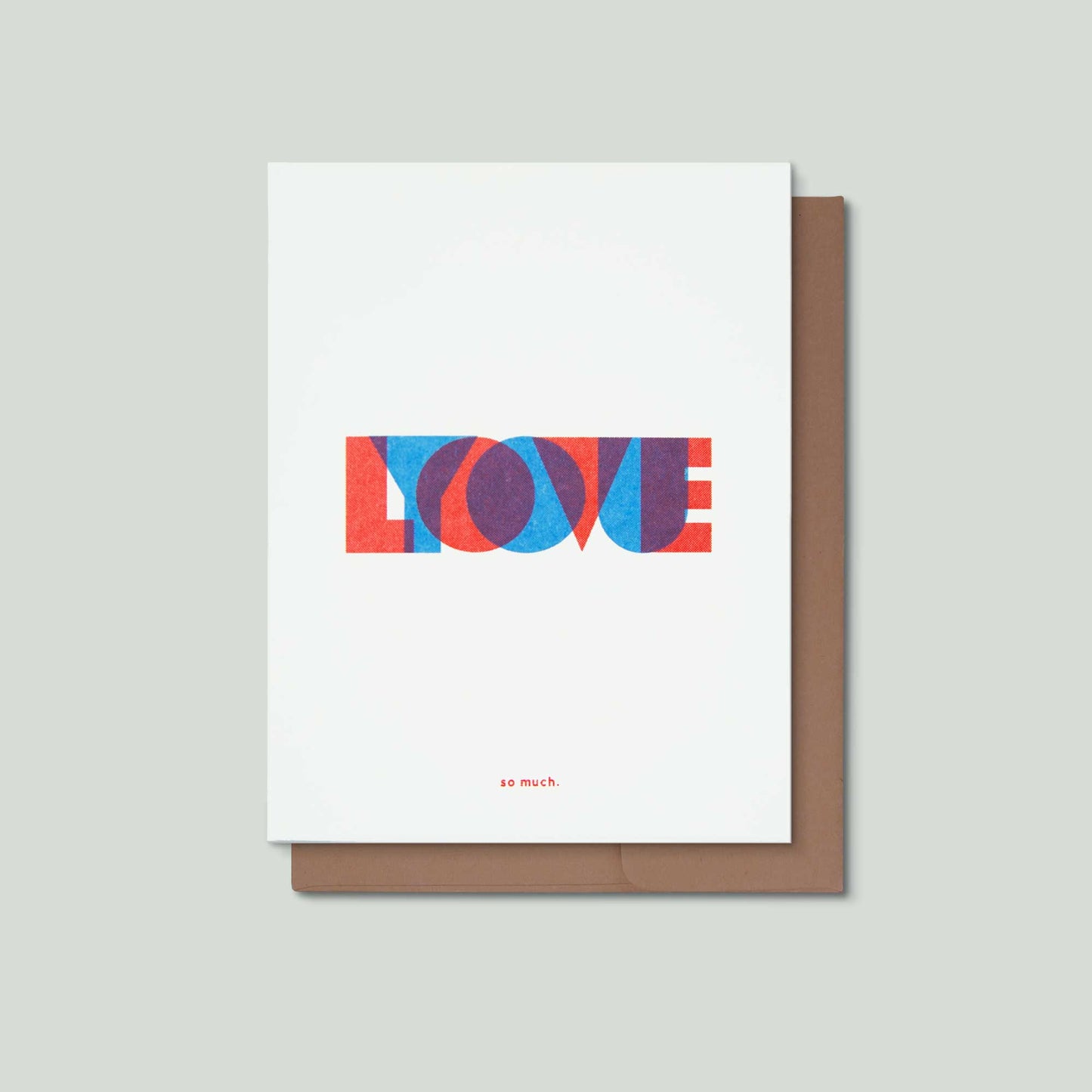 A white greeting card with the word 'LOVE' spelled out in red, and overlaying it the word "YOU" in blue, with the phrase 'so much.' printed below in small red text.