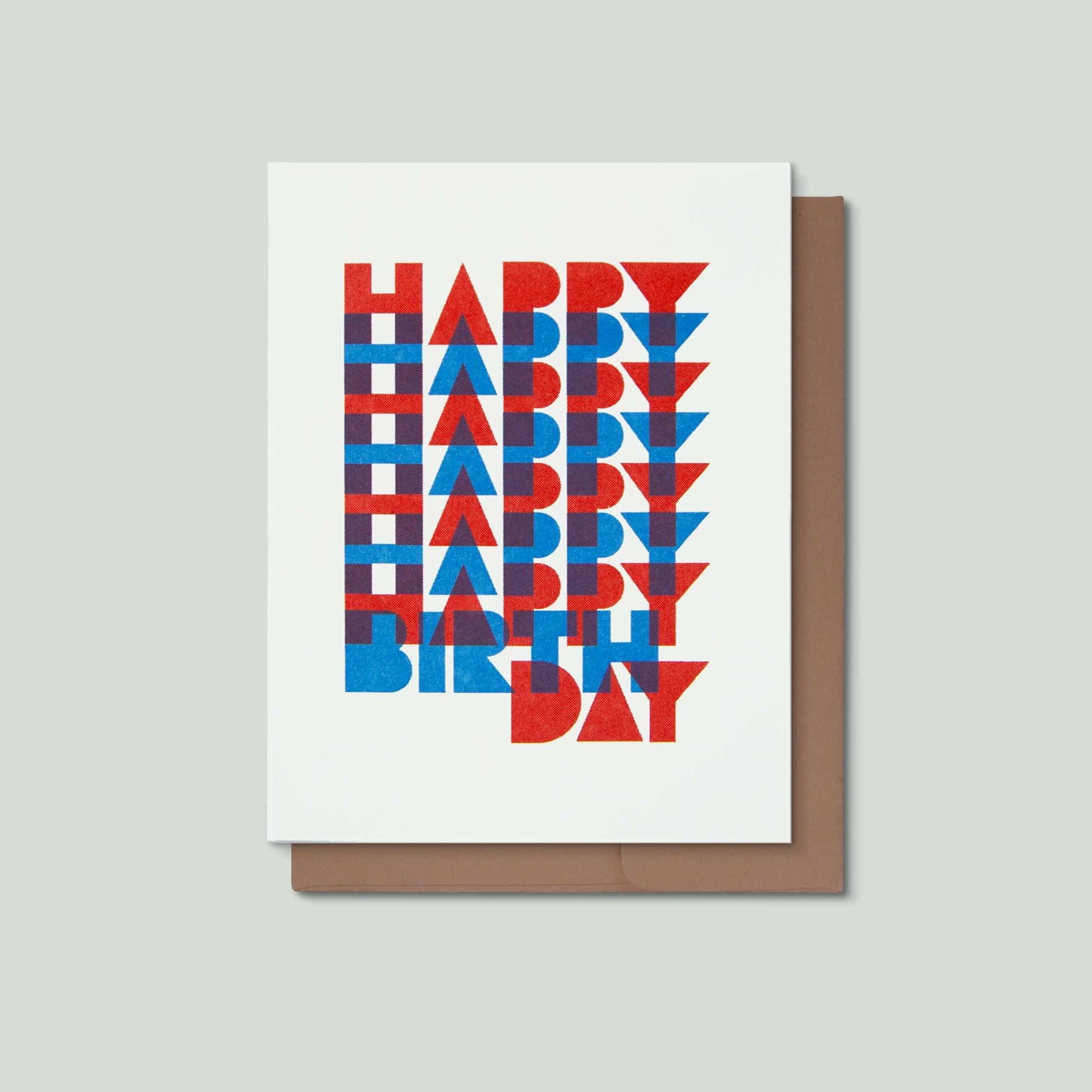 A greeting card with a white background and a brown envelope behind it, featuring the words 'HAPPY BIRTHDAY' in stacked red and blue geometric letters.