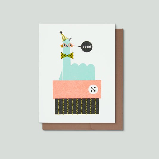 Greeting card with a smiling finger saying boop! on a gray background