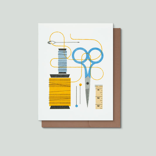Greeting card with sewing tools illustration on a white background