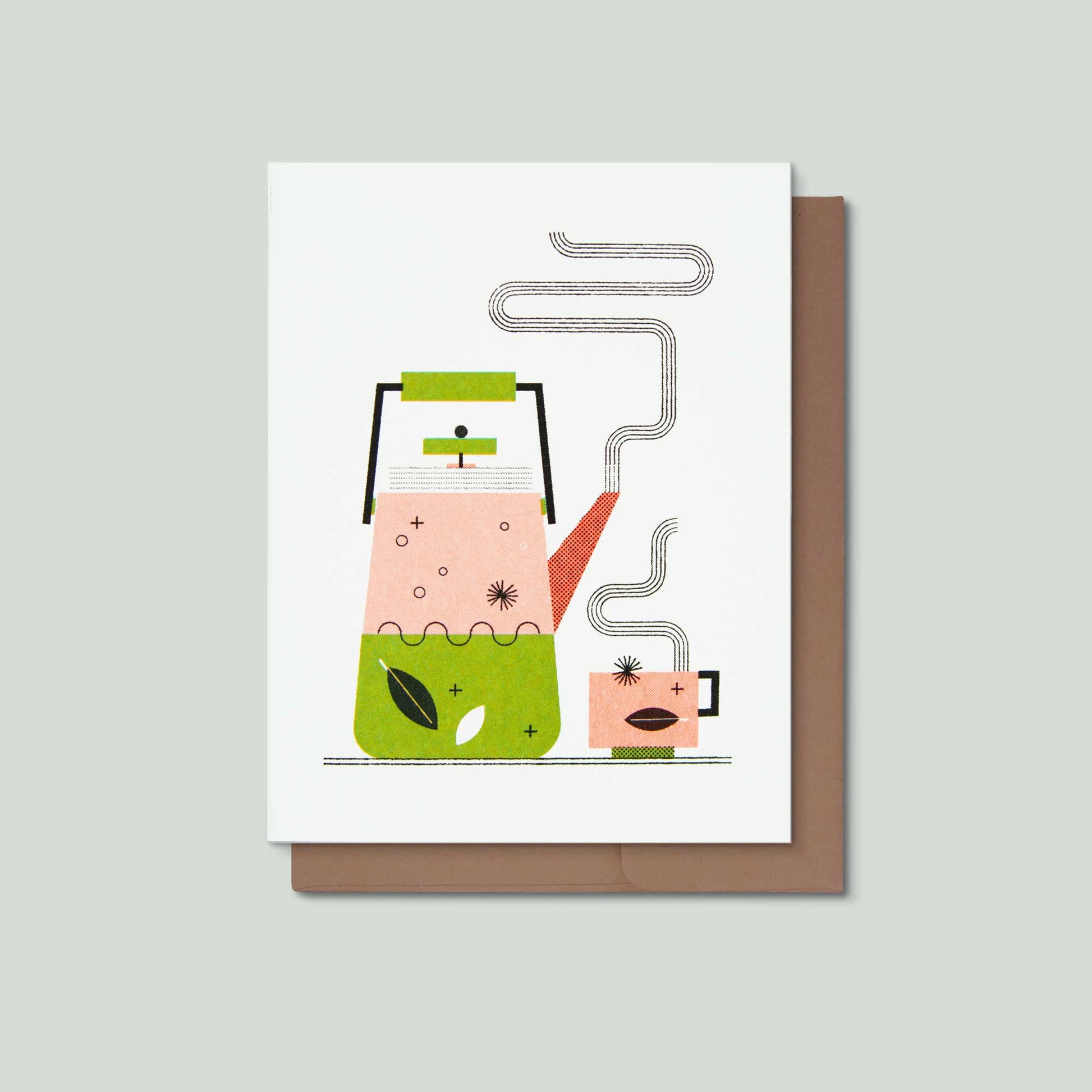 A greeting card featuring a stylized illustration of a pink teapot and cup with green and orange accents, shown with a brown envelope on a light gray background.