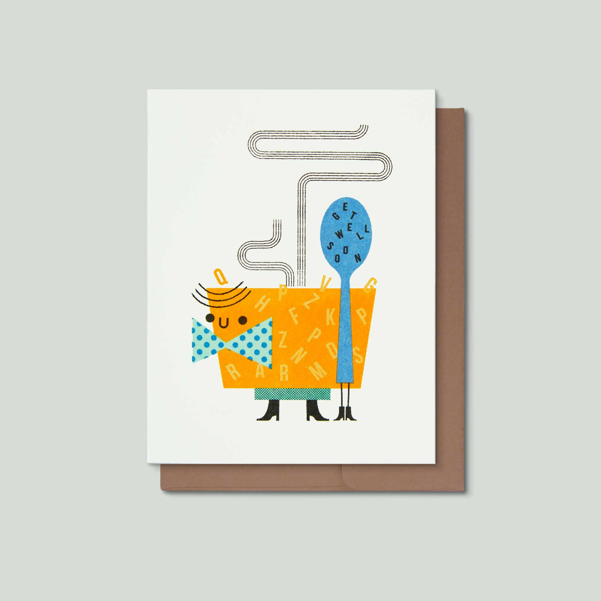 A greeting card with a whimsical illustration of a bowl of alphabet soup character wearing a blue polka-dot bow tie and standing next to a blue spoon with the words get well soon on it, shown with a brown envelope on a light gray background.