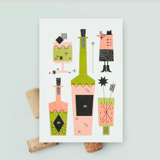 A white recipe card featuring a whimsical retro illustration of cocktail glasses and bottles in pink, green, and black, styled on a light background with cork props.
