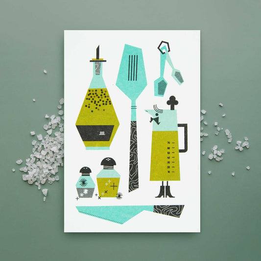 A greeting card featuring stylized kitchen utensils and containers in teal, olive green, black, and white, displayed on a sage green background with scattered salt.