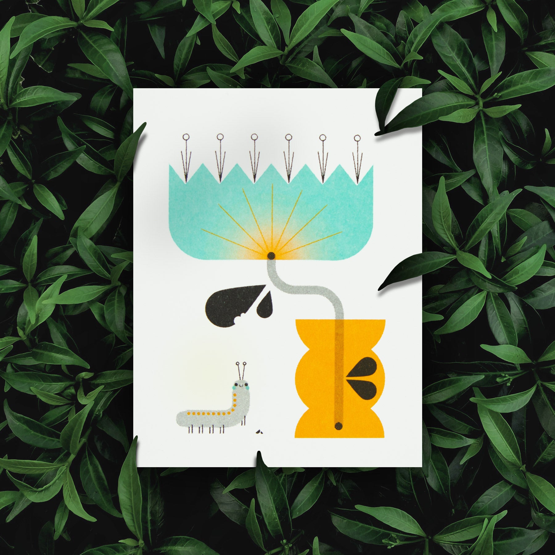 Illustration of a plant with a caterpillar on a white risograph greeting card, surrounded by green leaves.