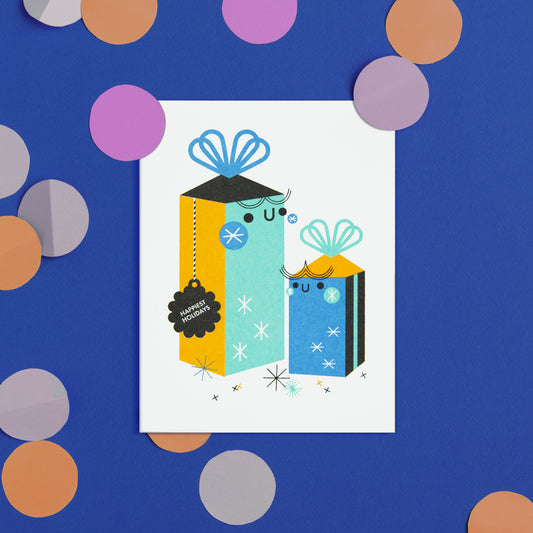 Illustration of gift boxes with a 'Happy Holidays' tag on a blue background with colorful confetti.