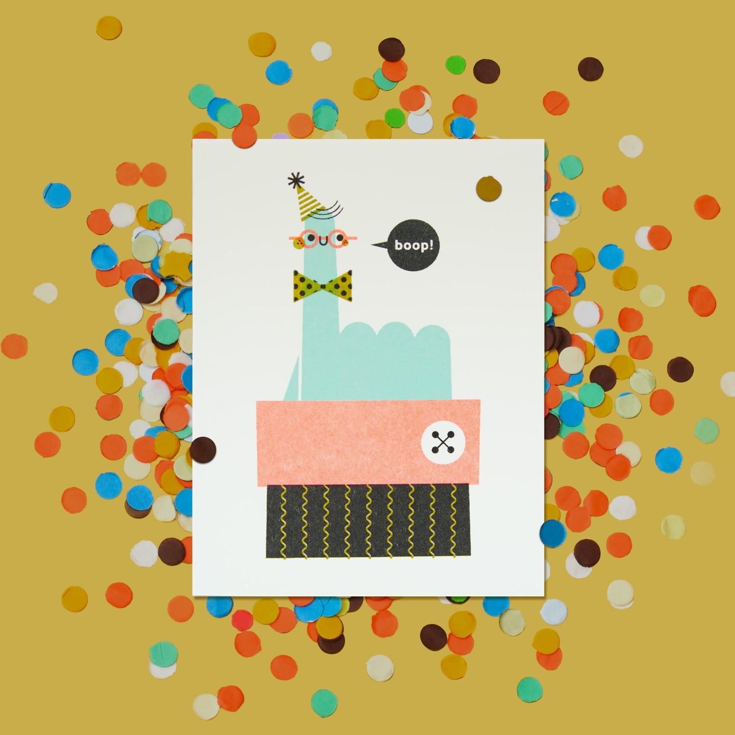 Illustrated risograph greeting card with a smiling finger wearing a party hat, bowtie and glasses saying boop! on a yellow background with colorful confetti