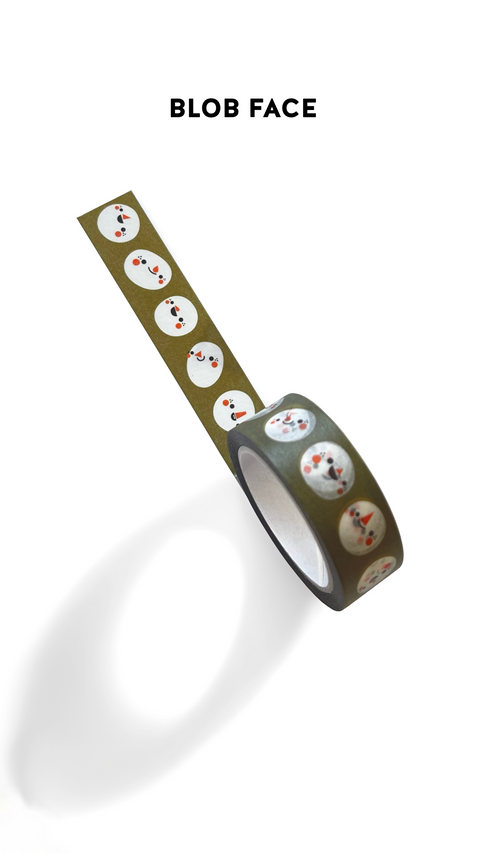 Decorative washi tape with white blobby faces on a green background. The design is called 'Blob Face'.