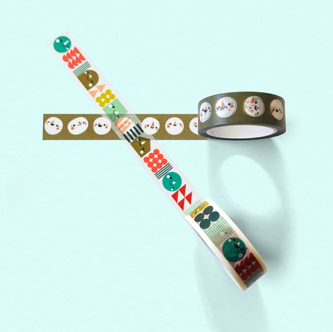 Two rolls of decorative washi tape with colorful patterns on a light blue background. Photo includes two designs called 'block party', and 'blob face.'